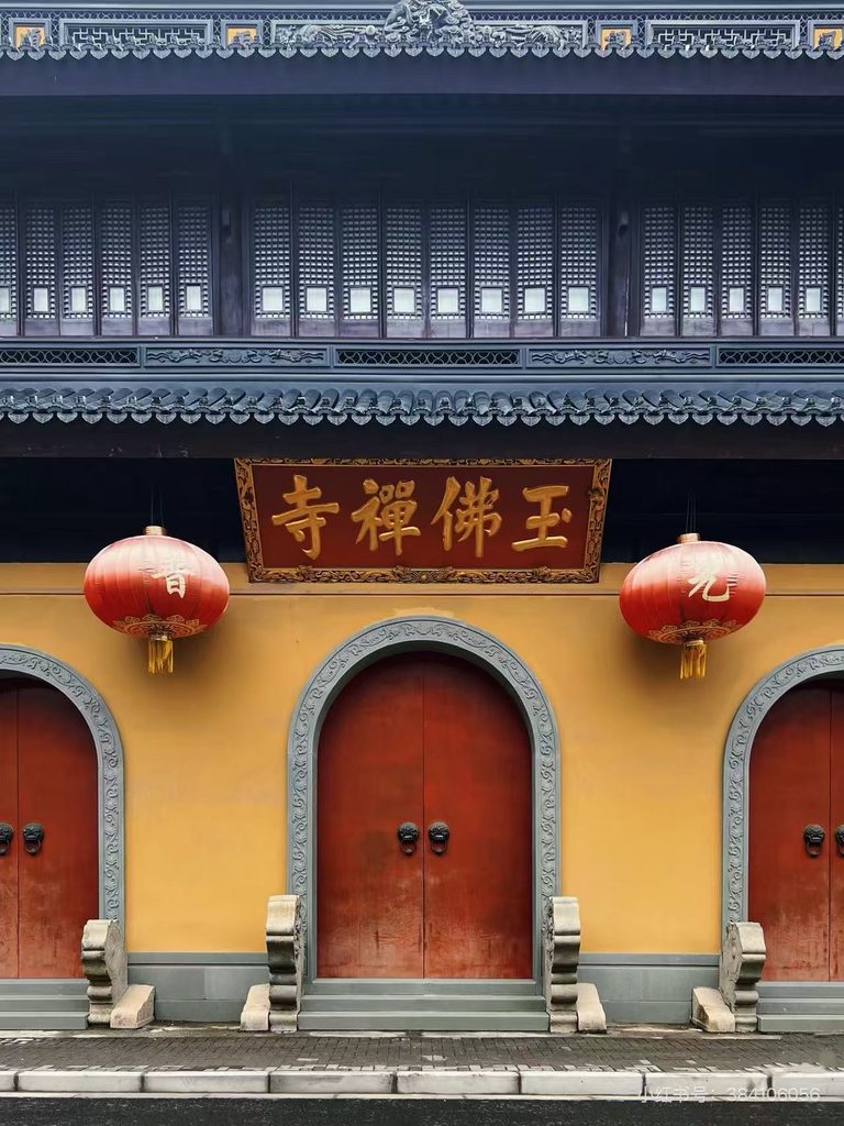 Jade Buddha Temple entrance in Shanghai with red doors, lanterns and traditional roof details